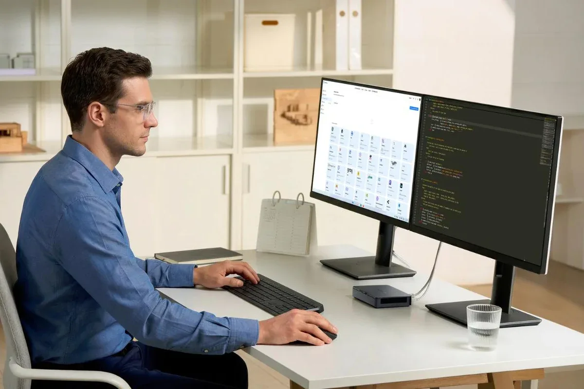 Khadas Mind Pro mini PC on a desk powering a dual-monitor setup